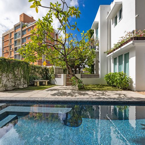 Enjoy a refreshing swim by the huge pool just steps from your door. sunbathe