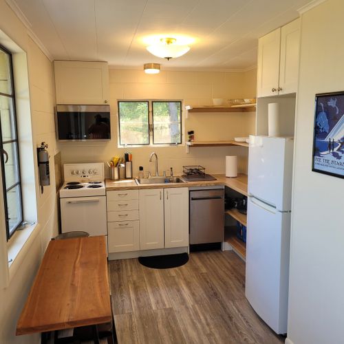 Kitchen:  the home has a very cute and newly updated kitchen with all appliances, including a dishwasher. Also includes a small breakfast nook with stools and a great view of crystal lake!