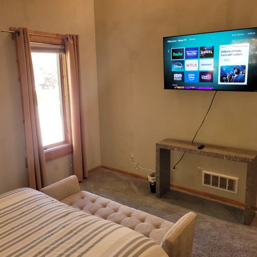 BEDROOM #2 (SECOND FLOOR):  Features a queen-size bed, closet, mirror, and private live-streaming television.