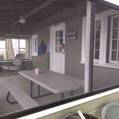 Front porch:  the cabin has a lovely screened-in porch with a picnic table and a great view of little platte lake