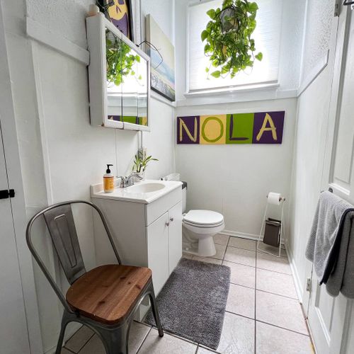 Clean, functional bathroom w/ a sink & all the essentials for a comfortable stay.