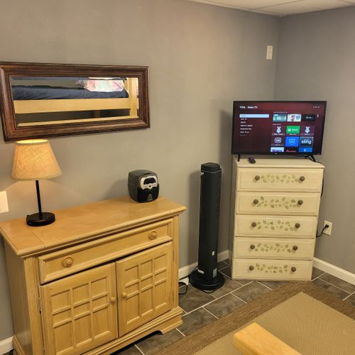 Bedroom:  cute bedroom with a twin-on-full bunk bed, electric heater, fan, 2 dressers, closet, lamp, and a television.
