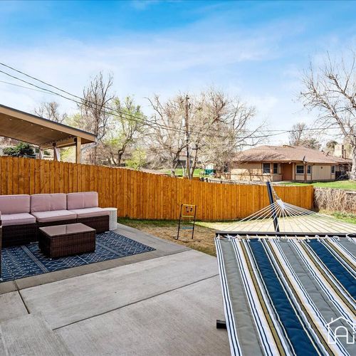 Relax and enjoy the sun in your own backyard with this spacious sectional and hammock!
