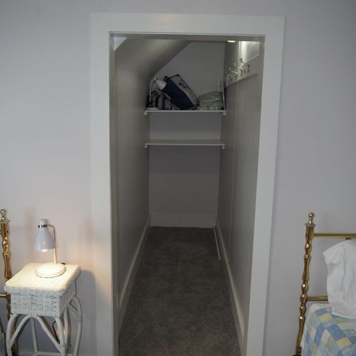 Bedroom #3:  all 3 bedrooms are upstairs. This bedroom features two twin-size beds, a nightstand with a lamp, a dresser with a mirror, and a large closet.