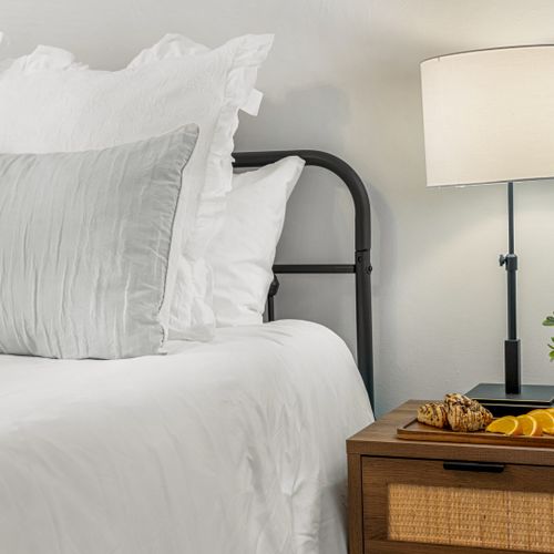 Soft lighting and warm tones create a welcoming bedroom vibe perfect for deep, restful sleep.