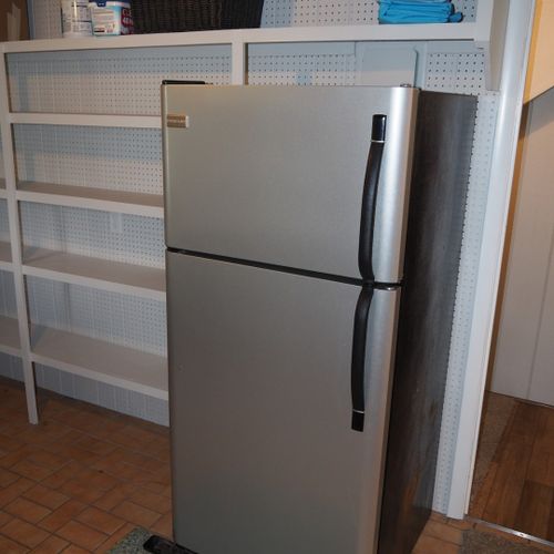 Laundry and mudroom:  convenient laundry room and mudroom with an extra refrigerator. Also includes a half-bathroom.
