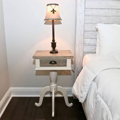 Soft microfiber sheets & a bedside lamp set the mood for restful nights.