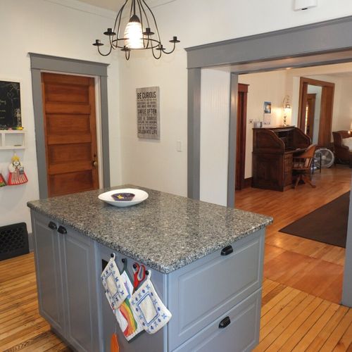 Kitchen:  another angle, showing the entrance out to the dining area (on the right) and the door to the first floor bathroom (on the left).
