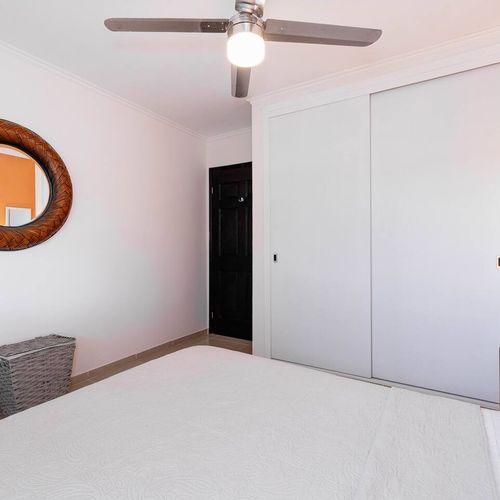 Bedroom with inside closet.