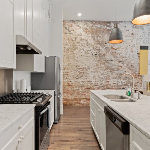 Kitchen space with historic brick walls