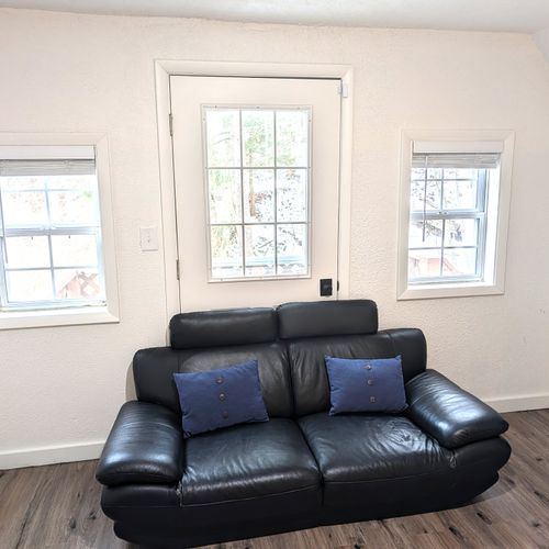 LIVING ROOM #2 (UPPER LEVEL):  Very fun and casual living room / game room on the upper level with a sofa, television, and lots of games in the drawers.