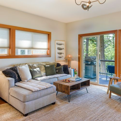The living room is designed for relaxation and connection. Enjoy a movie on the TV, stretch out on the comfy sofa or single chair, and share snacks around the center table. Step out onto the balcony for fresh air and scenic views all while staying