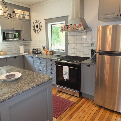 Kitchen:  another angle, highlighting the electric range and the new stainless steel refrigerator.