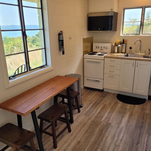 Kitchen:  the home has a very cute and newly updated kitchen with all appliances, including a dishwasher. Also includes a small breakfast nook with stools and a great view of crystal lake!