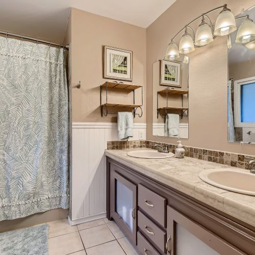 There is also a private ensuite bathroom with double-vanities and a shower/tub option.