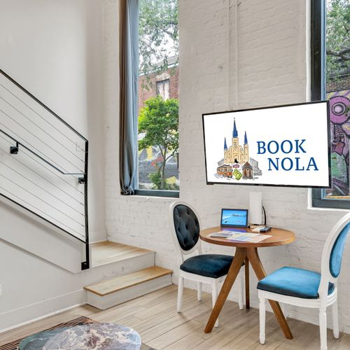 Bright desk nook w/ a city-themed print — ideal for catching up on work.