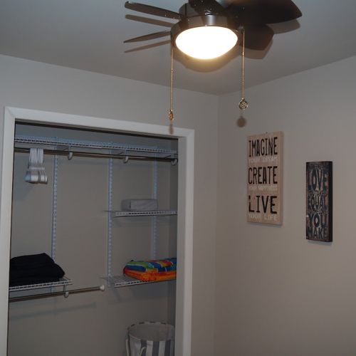 Bedroom #2:  also features a queen-size bed, ceiling fan, and closet.