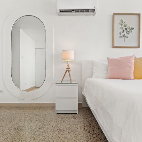 White walls and a light wood floor create a clean and open feel.