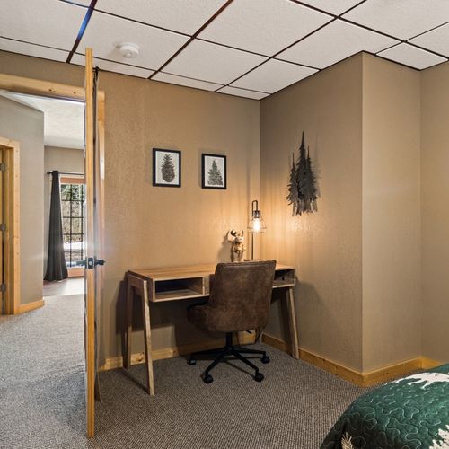 Bedroom #2 (lower level):  features a queen-size bed, chair, desk, closet, and private en-suite full bathroom.