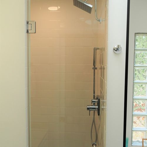 Bathroom #2 (main floor):  this is a private en suite bathroom for the master bedroom (bedroom #1). Features 2 sinks, a large bathtub, and separate shower and toilet facilities.