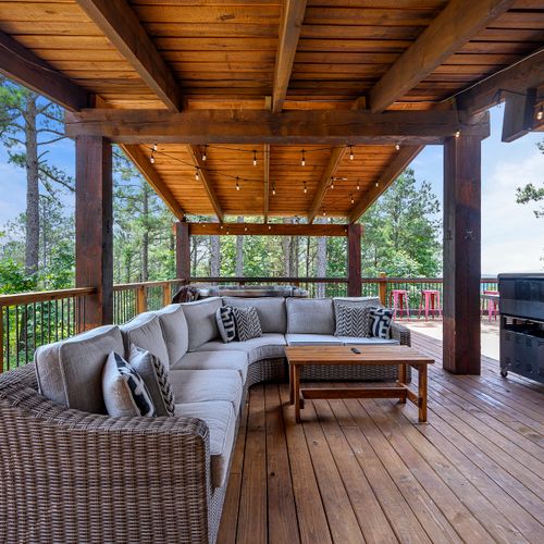 An oversized sectional sits on the patio for all to enjoy.