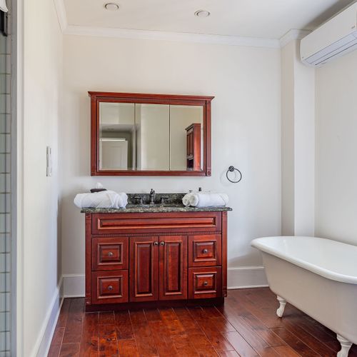 The main bathroom on the second floor with an iconic claw-foot bath tub.