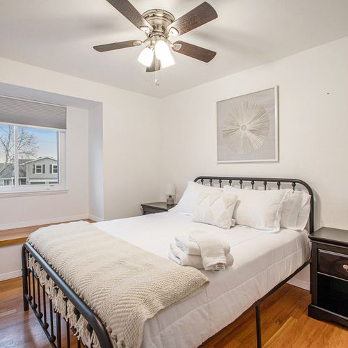 The upstairs bedroom offers a queen-sized bed and reading nook for your enjoyment.