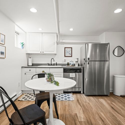 Extra convenience with a sleek basement kitchenette ready for quick bites.