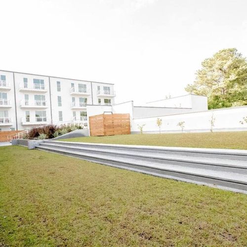 Manicured grounds & open green space right outside your door.