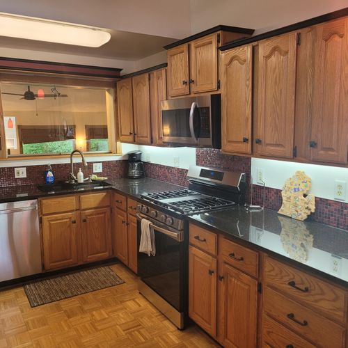 Overall:  the modern kitchen, with all appliances (including a dishwasher) and a good collection of cooking and dining supplies.