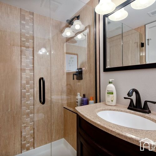 Enjoy the convenience of provided toiletries and towels in all of our bathrooms, two of which feature walk-in glass door showers