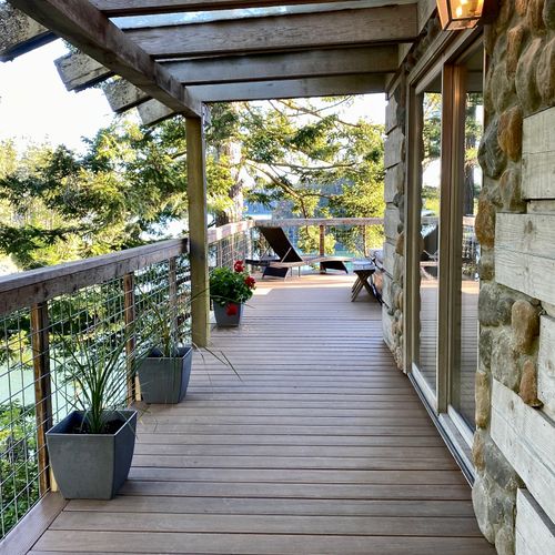 Wrap around deck leading from BBQ area to the outdoor spa