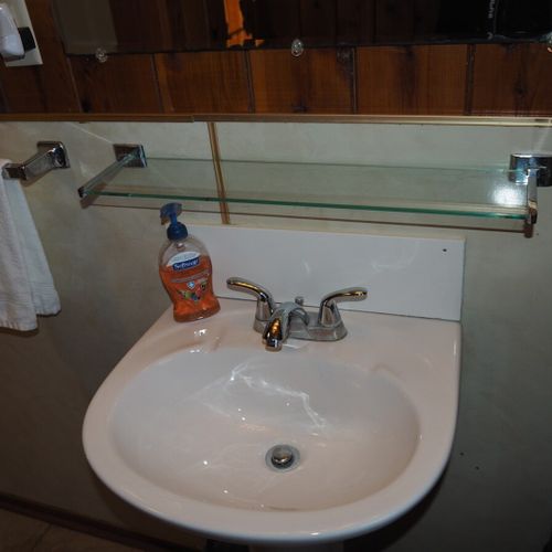 Bathroom (main floor):  the cabin has a full bathroom on the main floor with a combination tub / shower.