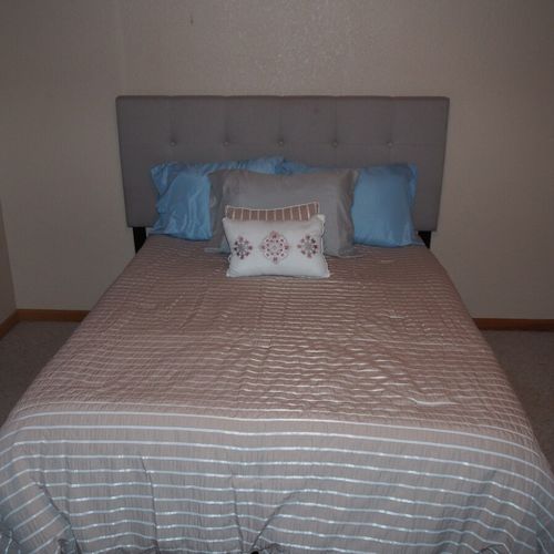 Bedroom #3 (upstairs):  features a full-size bed, dresser, and closet.