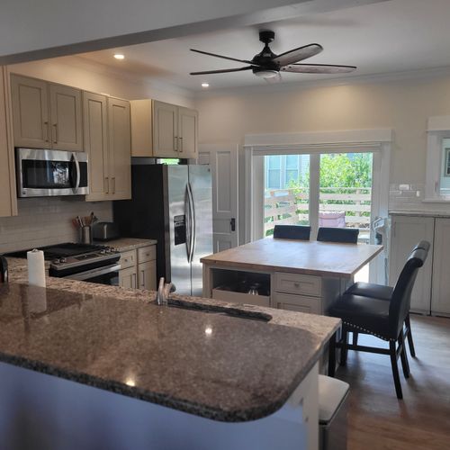 Kitchen:  the home has a newly-renovated kitchen with a large kitchen island and all appliances, including a dishwasher. There is also a good supply of cooking and dining utensils provided.