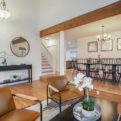The open layout of this home's dining area and living room is perfect for entertaining and brings everyone together.