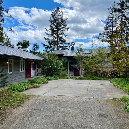 Parking area inside the gate for two cars.  There are two other parking areas just outside the gate by the garage.