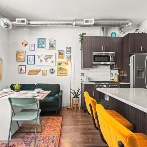 Stylish bar seating and kitchen details creating a warm, welcoming atmosphere here