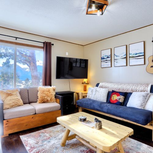 The cozy living room area perfect for doing work, talking,  playing games, or simply relaxing.