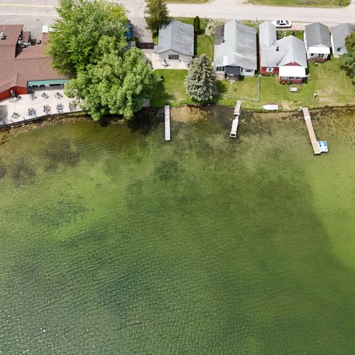 Overall:  a broader drone photo, which also shows the restaurant next door (at the upper left of the photo).