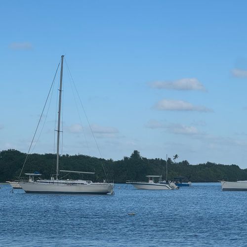 Scenic Seascape: Gaze upon the tranquil waters dotted with sailboats, offering a picturesque view that epitomizes coastal living.