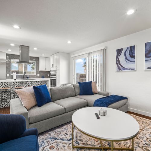 Upstairs living room, bright and cozy, perfect for groups to unwind together.