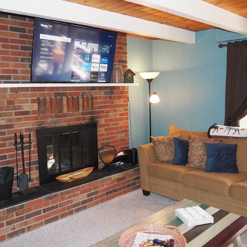 Living room:  the chalet has a super comfy living room with a sofa, loveseat, futon, coffee table, wood fireplace, and large live-streaming tv with roku.
