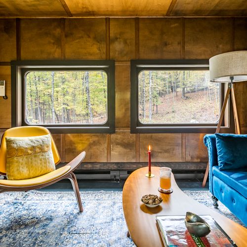 The office, equipped with a writing desk and additional seating.