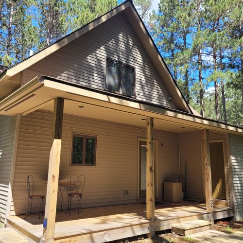 EXTERIOR:  The main entrances to the cabin, which is in the back of the house.