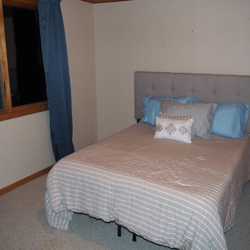 Bedroom #3 (upstairs):  features a full-size bed, dresser, and closet.