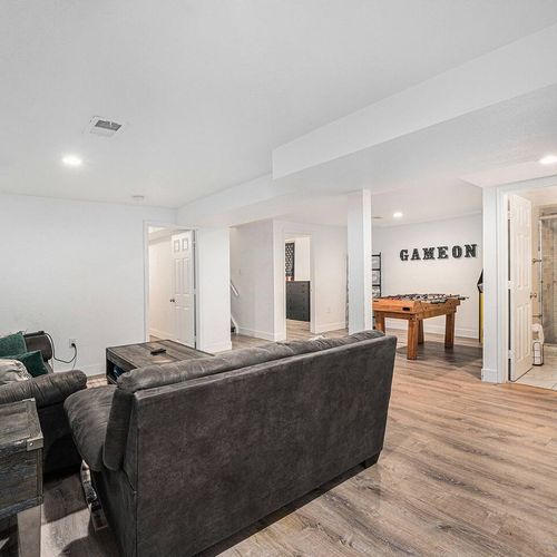 - game on and wind down in this dual purpose basement hangout zone
- plush seating, board games, and foosball make it a hit for groups and families
- full bathroom nearby adds extra convenience for movie marathons or game nights