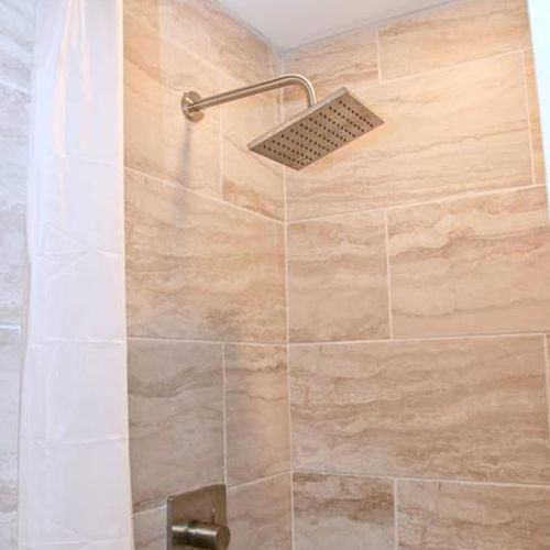 Rinse off under a rain shower head w/ perfect water pressure in the master bath.