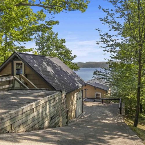 EXTERIOR:   The parking area for the property, which is up the hill from the house itself
