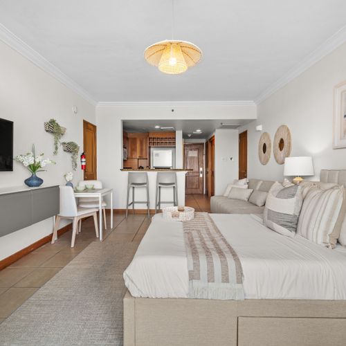 Cozy bedroom with plush queen bed & stylish decor. Your peaceful sanctuary awaits.